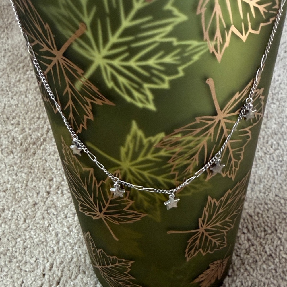 James Avery 16 inch dangling stars necklace with lobster claw clasp.